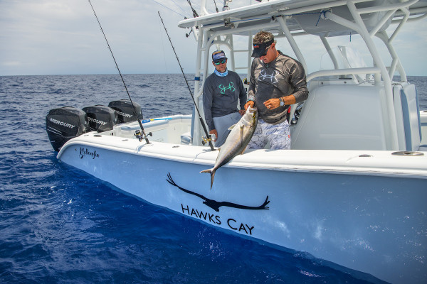 Captains Walker and Rodgers reel in their offshore catch. 