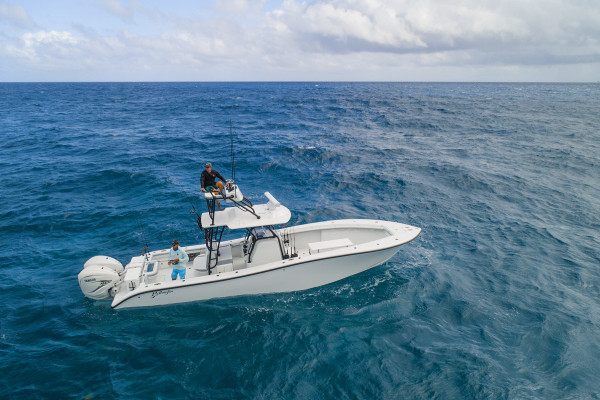 An aerial shot of the Into the Blue fishing charter shows the vast blue ocean.