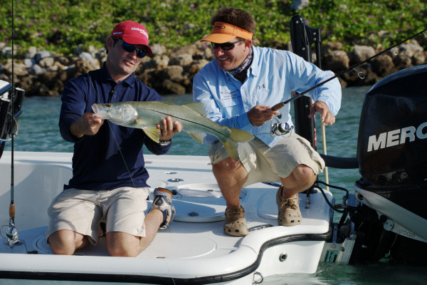 Captains from the Saltwater Experience show show off their catch after a day of Florida Keys fishing